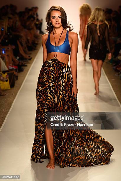 Model walks the runway during the Indah fashion show at Mercedes-Benz Fashion Week Swim 2015 at Cabana Grande at The Raleigh on July 21, 2014 in...