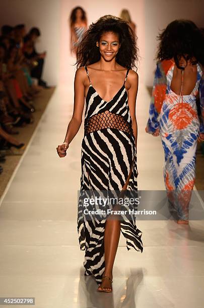 Model walks the runway at the Indah fashion show during Mercedes-Benz Fashion Week Swim 2015 at The Raleigh on July 21, 2014 in Miami Beach, Florida.
