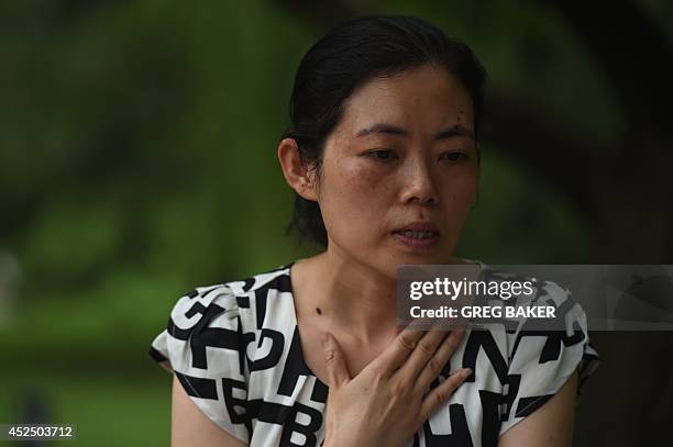 China-social-women-crime,FEATURE by Felicia Sonmez This photo taken on July 17, 2014 shows Ma Shuyun during an interview in Beijing as she describes...