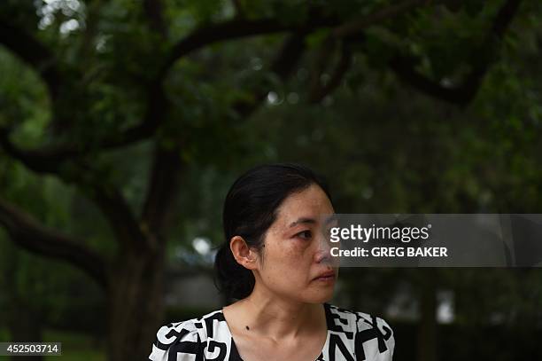 China-social-women-crime,FEATURE by Felicia Sonmez This photo taken on July 17, 2014 shows Ma Shuyun during an interview in Beijing as she describes...