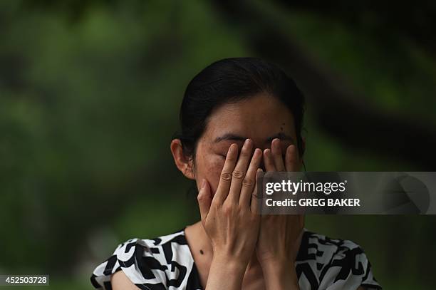 China-social-women-crime,FEATURE by Felicia Sonmez This photo taken on July 17, 2014 shows Ma Shuyun during an interview in Beijing as she describes...