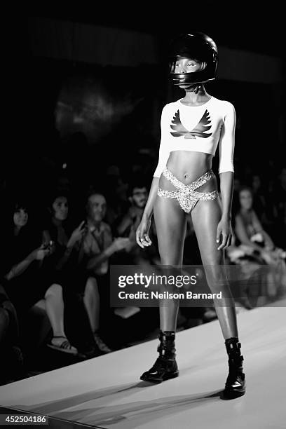 Model walks the runway at the Minimale Animale fashion show during Mercedes-Benz Fashion Week Swim 2015 at The Raleigh on July 21, 2014 in Miami...