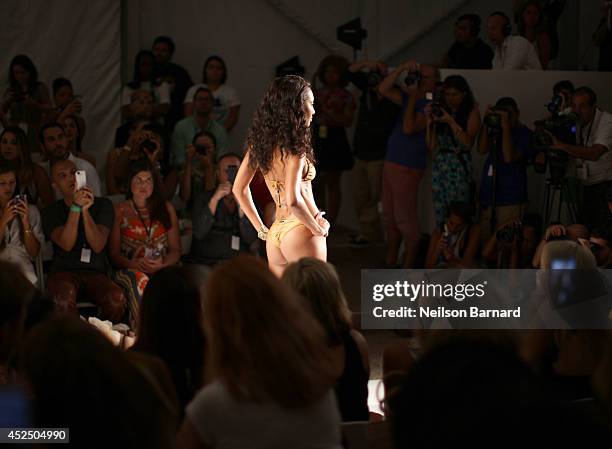 Model walks the runway during the Minimale Animale show during Mercedes-Benz Fashion Week Swim 2015 at The Raleigh on July 21, 2014 in Miami Beach,...