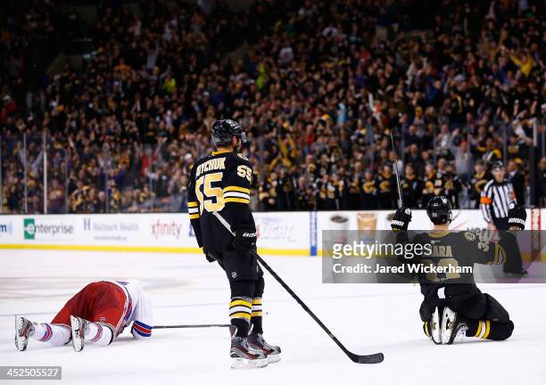 Zdeno Chara of the Boston Bruins celebrates his goal in the third period in front of teammate Johnny Boychuk against the New York Rangers during the...