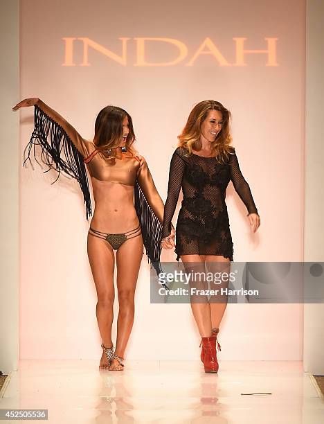 Designer Libby De Santis walks the runway during Indah show at Mercedes-Benz Fashion Week Swim 2015 at Cabana Grande at the Raleigh on July 21, 2014...