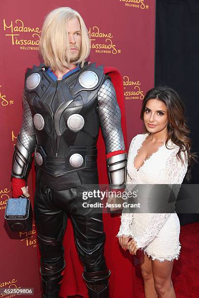 Actress Mikaela Hoover poses alongside a Madame Tussauds Hollywood MARVEL wax figure during the "Guardians of The Galaxy" premiere at the Dolby...