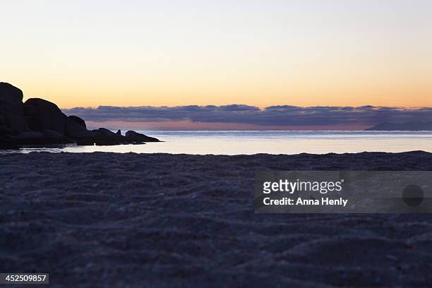 dawn seascape with rock and sand - baja california peninsula stock-fotos und bilder