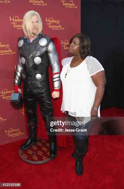 Actress Retta poses alongside a Madame Tussauds Hollywood MARVEL wax figure during the "Guardians of The Galaxy" premiere at the Dolby Theatre on...