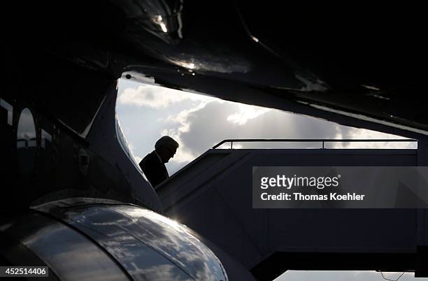 German Foreign Minister Frank-Walter Steinmeier enters an airplane on July 22, 2014 at the airpot in Berlin Tegel, Germany. Steinmeier will travel to...