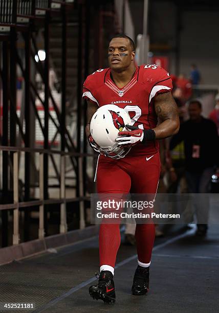 Inside linebacker Jasper Brinkley walks out onto the field before the NFL game against the Indianapolis Colts at the University of Phoenix Stadium on...