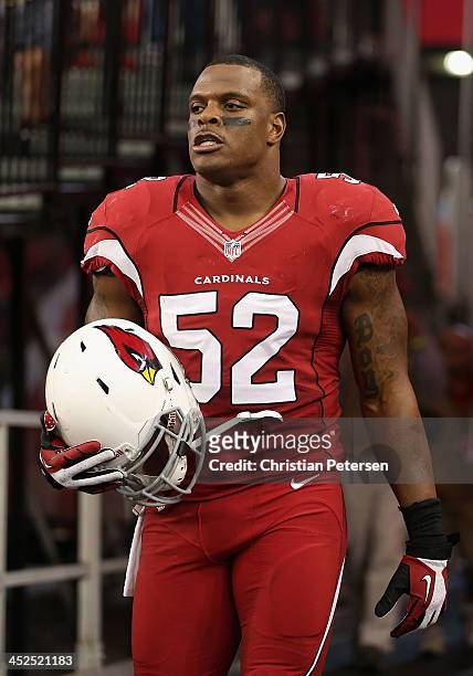 Inside linebacker Jasper Brinkley walks out onto the field before the NFL game against the Indianapolis Colts at the University of Phoenix Stadium on...
