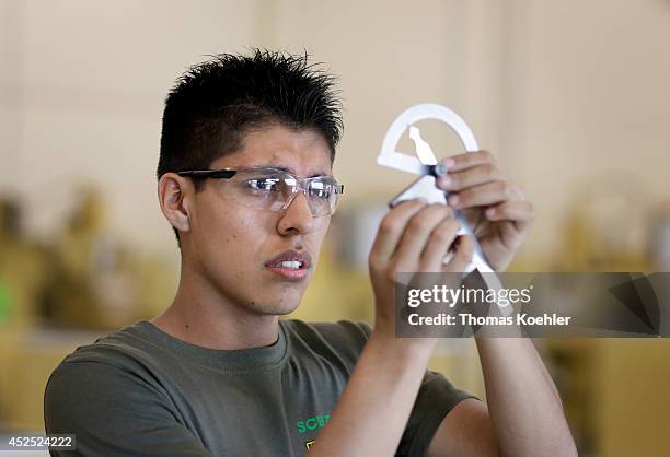 Apprentice as metal worker measuring a workpiece in the workshop of Schaeffler Group on July 18 in Irapuato, Mexico. The Schaeffler Technologies AG &...