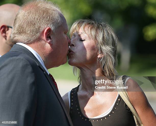 Mayor Rob Ford kisss his wife Renata after he and Councillor Karen Stintz attend the Woburn Park re-opening after being re-developed in Toronto. July...