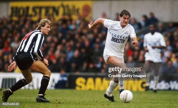 Tottenham Hotspur player Glenn Hoddle races past Andy Thomas of Newcastle United during an FA Cup match between Tottenham Hotspur and Newcastle...