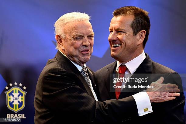 Carlos Dunga greets President of the Brazilian Football Confederation , Jose Maria Marin during a press conference to announce Dunga as the new coach...