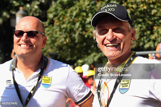 Tinkoff-SaxoTeam Manager Bjarne Riis and Team Owner Oleg Tinkoff watch the podium ceremony during the sixteenth stage of the 2014 Tour de France, a...
