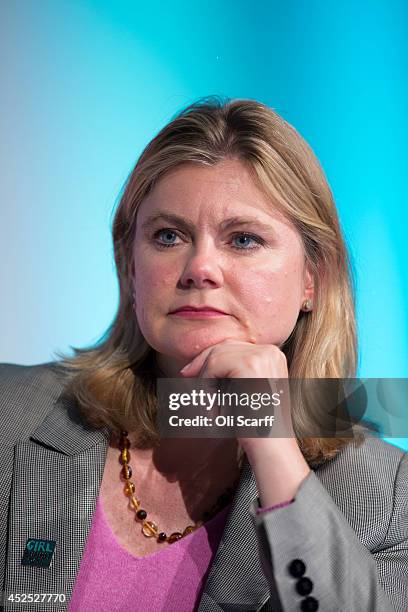 Justine Greening, the Secretary of State for International Development, listens to the speeches at the 'Girl Summit 2014' in Walworth Academy on July...