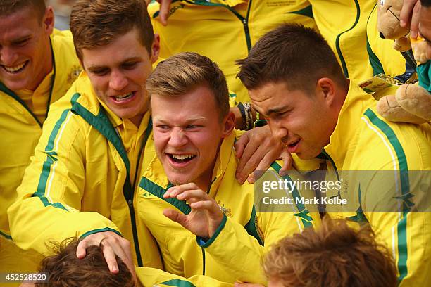 Cameron Clark of the Australian men's sevens rugby team shares a laugh with his team as they pose before the Australian Commonwealth Games official...