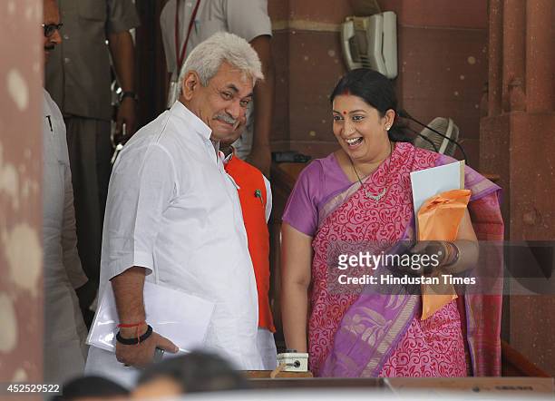 Union HRD Minister Smriti Irani talking with Union Minister of State for Railways Manoj Sinha after BJP Parliamentary party leaders meeting at...