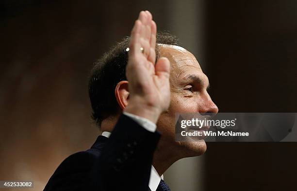 Robert McDonald, President Obama's nominee to be the Secretary of Veterans Affairs, is sworn in prior to testifying before the Senate Veterans...