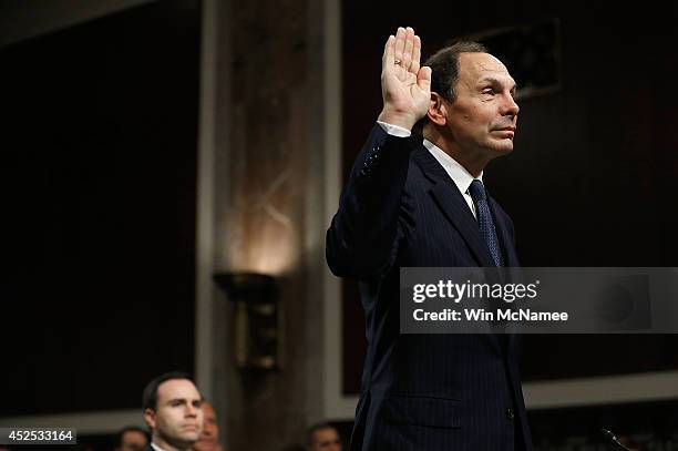 Robert McDonald, President Obama's nominee to be the Secretary of Veterans Affairs, is sworn in prior to testifying before the Senate Veterans...