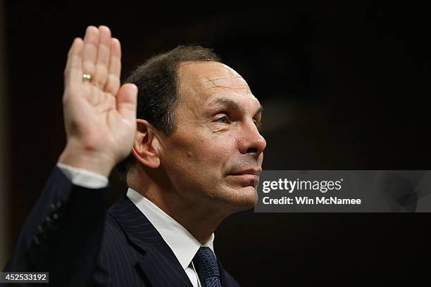 Robert McDonald, President Obama's nominee to be the Secretary of Veterans Affairs, is sworn in prior to testifying before the Senate Veterans...