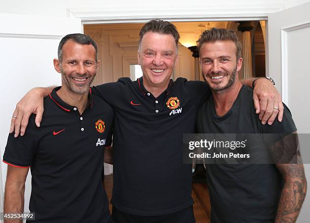 Manager Louis van Gaal of Manchester United and Assistant Manager Ryan Giggs meet David Beckham at the team hotel as part of their pre-season tour of...