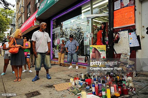 People attend a vigil for Eric Garner near where he died after he was taken into police custody in Staten Island last Thursday on July 22, 2014 in...