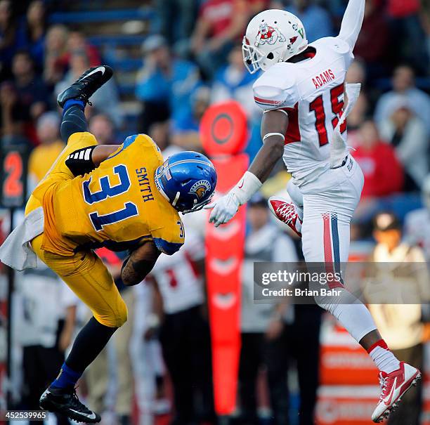 Linebacker Keith Smith of the San Jose Spartans intercepts quarterback Derek Carr on a pass intended for Davante Adams of the Fresno State Bulldogs...