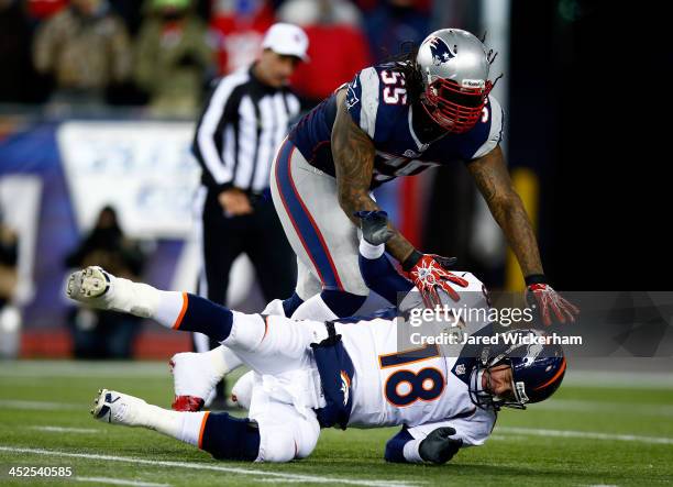 Middle linebacker Brandon Spikes of the New England Patriots tackles quarterback Peyton Manning of the Denver Broncos during a game at Gillette...