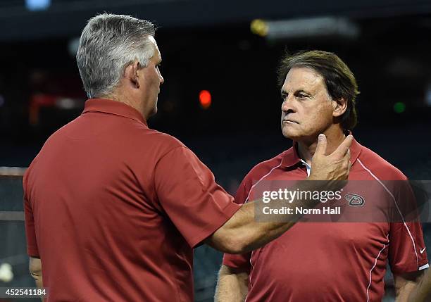 Chief Baseball Officer Tony LaRussa of the Arizona Diamondbacks talks with General Manager Kevin Towers prior to a game between the Arizona...
