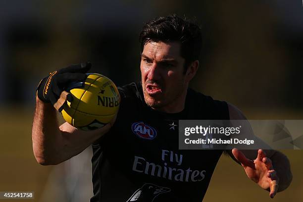 Quinten Lynch, making his comeback from injury, marks the ball during a Collingwood Magpies AFL training session at Westpac Centre on July 23, 2014...