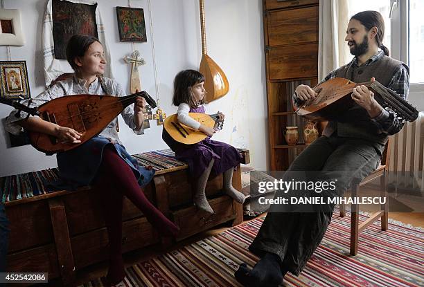 Beatrice Iordan , wife of Florin Iordan , ethnomusicologist at the Museum of the Romanian Peasant in Bucharest, plays cobza together with their...