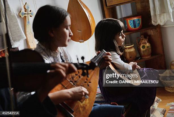 Beatrice Iordan , wife of Florin Iordan, ethnomusicologist at the Museum of the Romanian Peasant in Bucharest plays cobza together with their...
