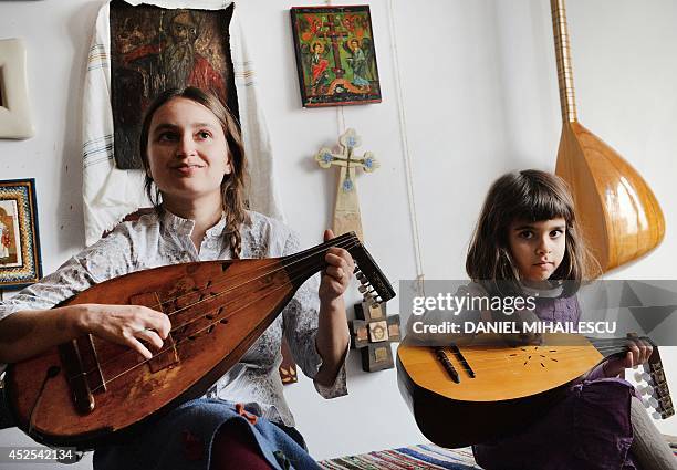 Beatrice Iordan , wife of Florin Iordan, ethnomusicologist at the Museum of the Romanian Peasant in Bucharest plays cobza together with their...