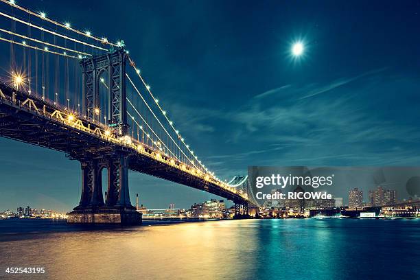 manhattan bridge in night with moon - manhattan bridge stock pictures, royalty-free photos & images