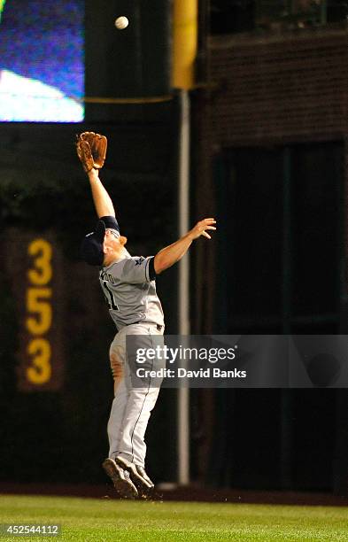 Brooks Conrad of the San Diego Padres can't make a play on a single by Nate Schierholtz during the eighth inning of the Chicago Cubs on July 22, 2014...