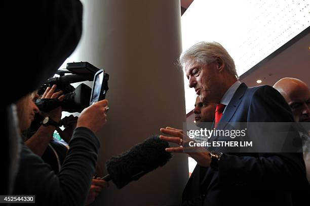 Former US president Bill Clinton talks at the International AIDS Conference at the Melbourne Convention and Exhibition Centre in Melbourne on July...