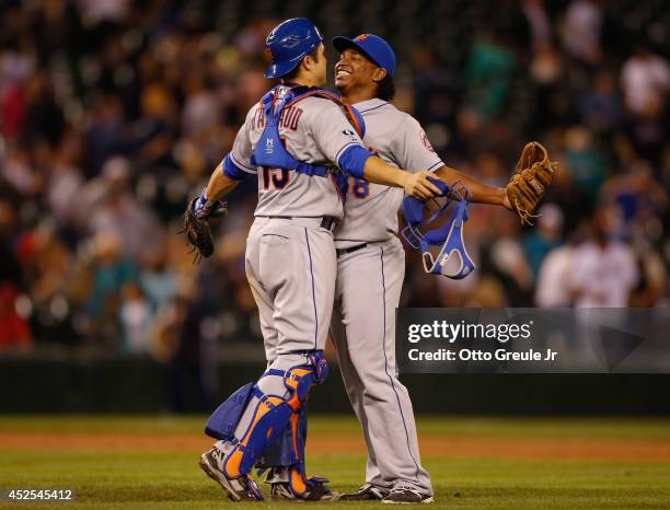 Closing pitcher Jenrry Mejia of the New York Mets is congratulated by catcher Travis d'Arnaud after defeating the Seattle Mariners 3-1 at Safeco...