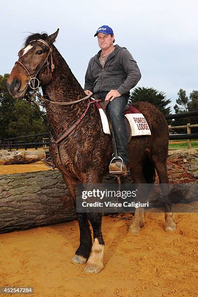 Trainer Darren Weir poses aboard his pony Bart after a Ballarat trackwork session at Ballarat Turf Club on July 23, 2014 in Ballarat, Australia.