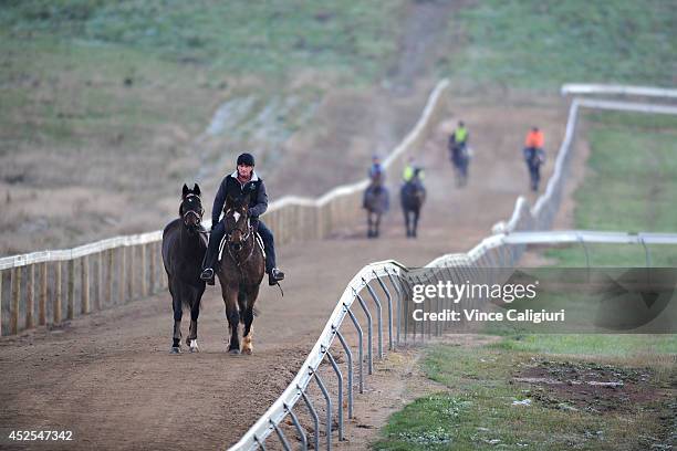 Trainer Darren Weir riding his pony Bart during a Ballarat trackwork session at Ballarat Turf Club on July 23, 2014 in Ballarat, Australia.