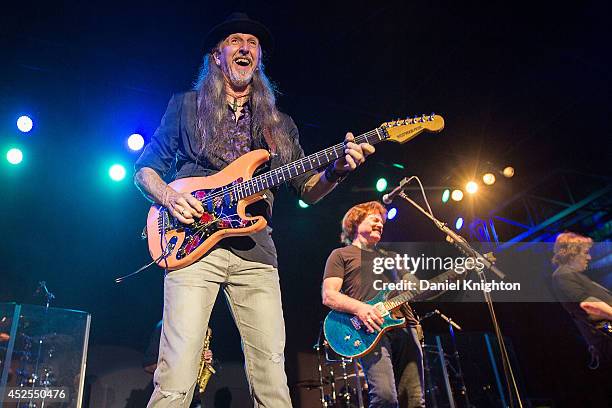 Musicians Pat Simmons, Tom Johnston and John McFee perform on stage with The Doobie Brothers on July 22, 2014 in San Diego, California.