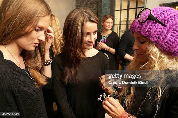 Katrin Kraus, Sheila Malek and Nina Heyd attend the 'House of Capulet' shop opening on November 29, 2013 in Munich, Germany.