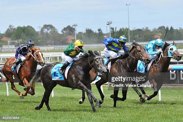 Ryan Maloney riding Girl in Flight winning Race 2, the Leigh Thomas Gift during racing at Caulfield Racecourse on November 30, 2013 in Melbourne,...