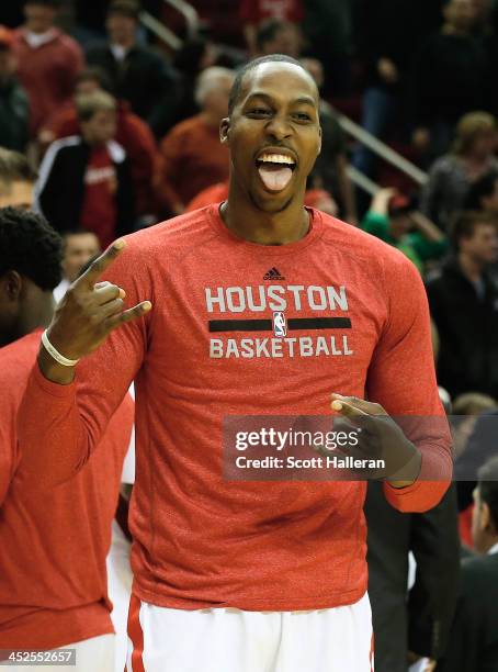 Dwight Howard of the Houston Rockets celebrates during a timeout during the game against the Brooklyn Nets at Toyota Center on November 29, 2013 in...