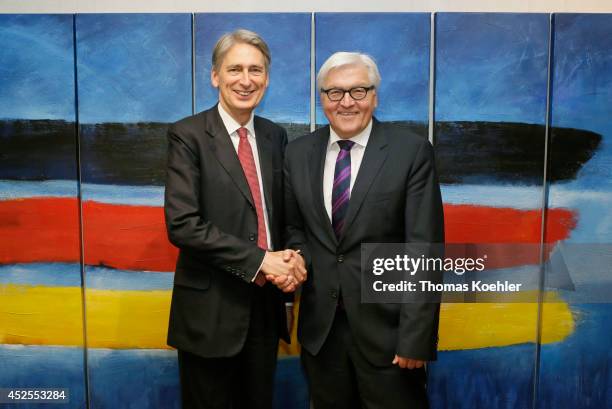 German Foreign Minister Frank-Walter Steinmeier meets with British Foreign Affairs Minister Philip Hammond on July 23, 2014 during a meeting of...