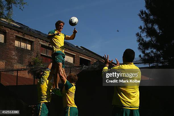 Con Foley of the Australia rugby sevens team catches a lineout bal during an Australian media call at the SECC on July 23, 2014 in Glasgow, Scotland.