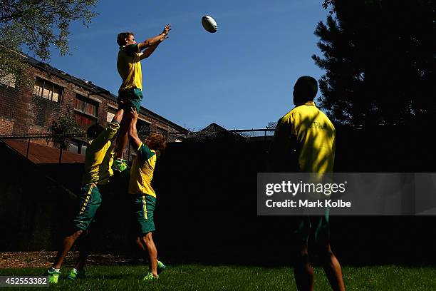 Con Foley of the Australia rugby sevens team catches a lineout bal during an Australian media call at the SECC on July 23, 2014 in Glasgow, Scotland.