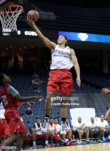 Ben Simmons in white with the layup during the National Basketball Players Association Top 100 Camp on June 18, 2014 at John Paul Jones Arena in...