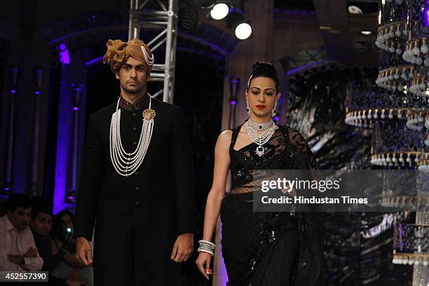 Model walk down the ramp during grand finale by Shree Raj Mahal Jewellers as a part of India Couture Week 2014 at the Taj Palace Hotel on July 20,...